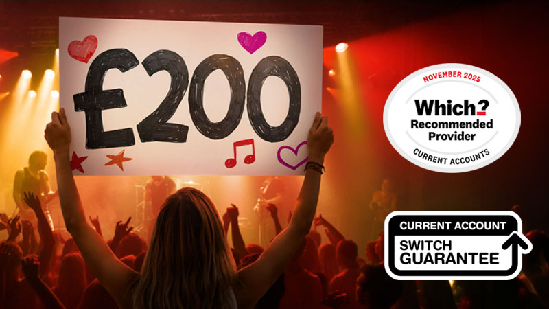 Person holding a “£200” sign at a concert, representing a £200 switching offer.