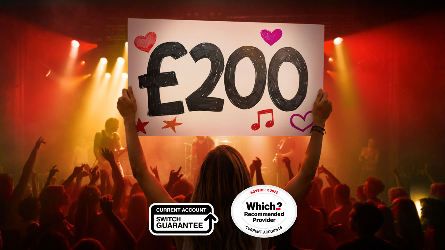 Person holding a “£200” sign at a concert, representing a £200 switching offer.