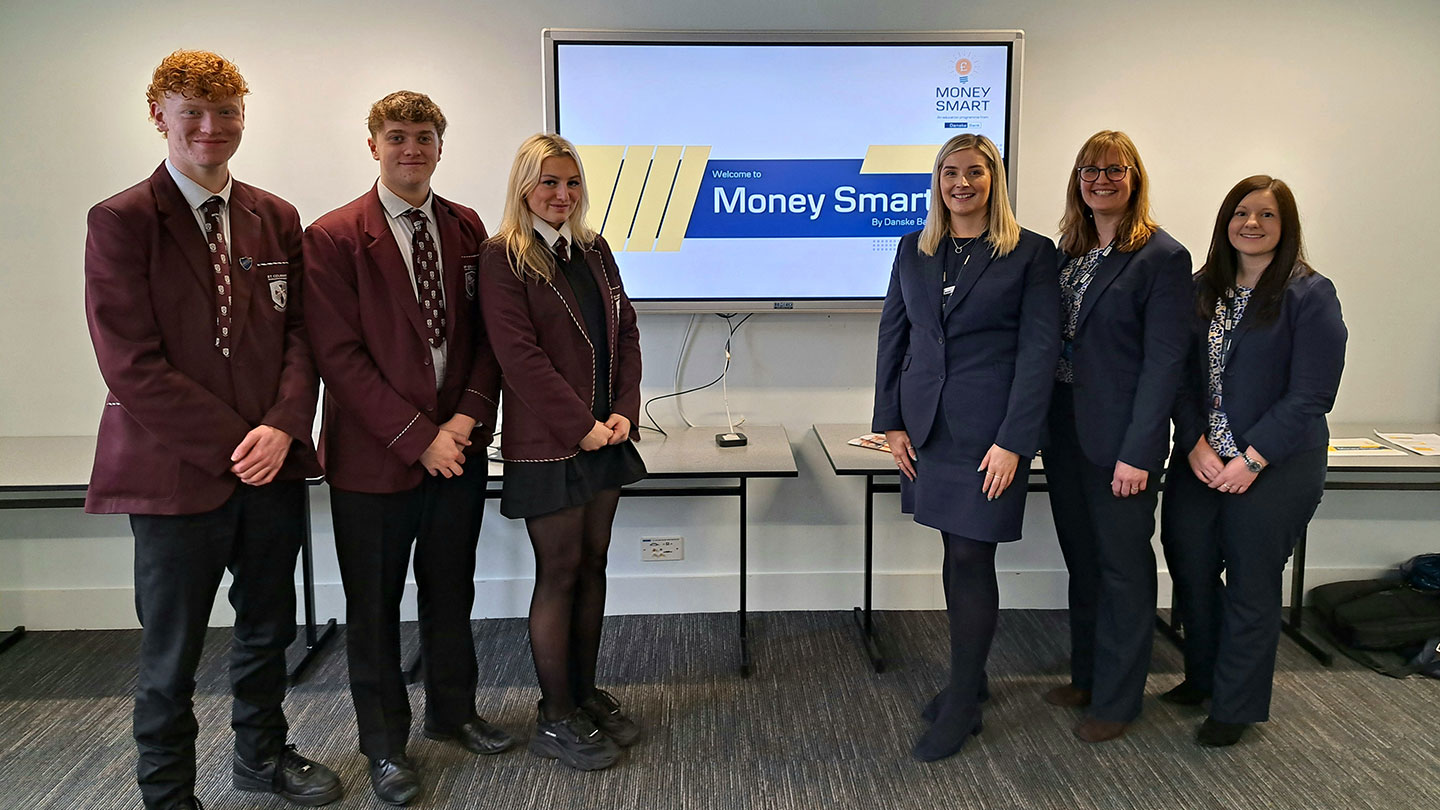 High school pupils pose with Danske staff for photo