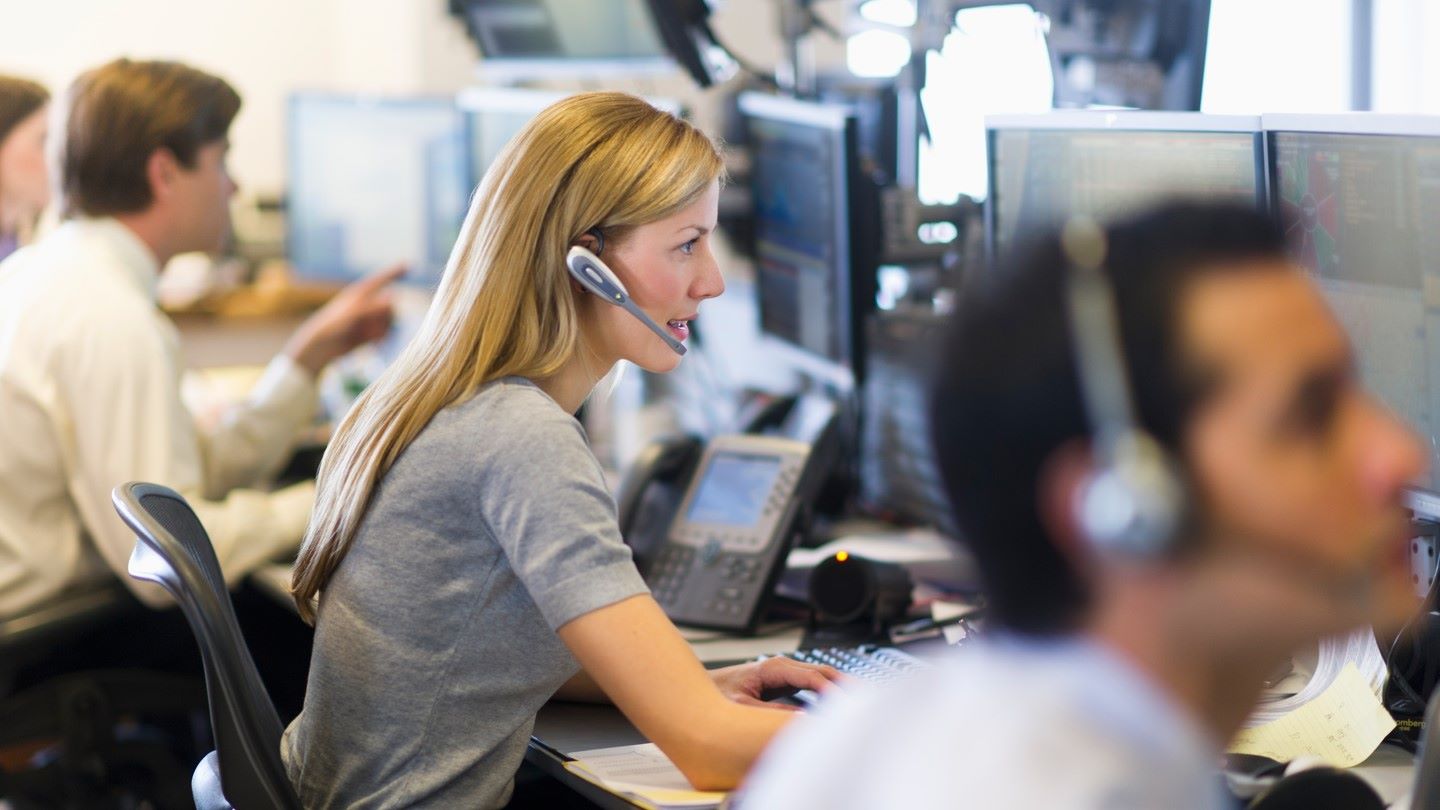 Female colleague on telephone helping a customer