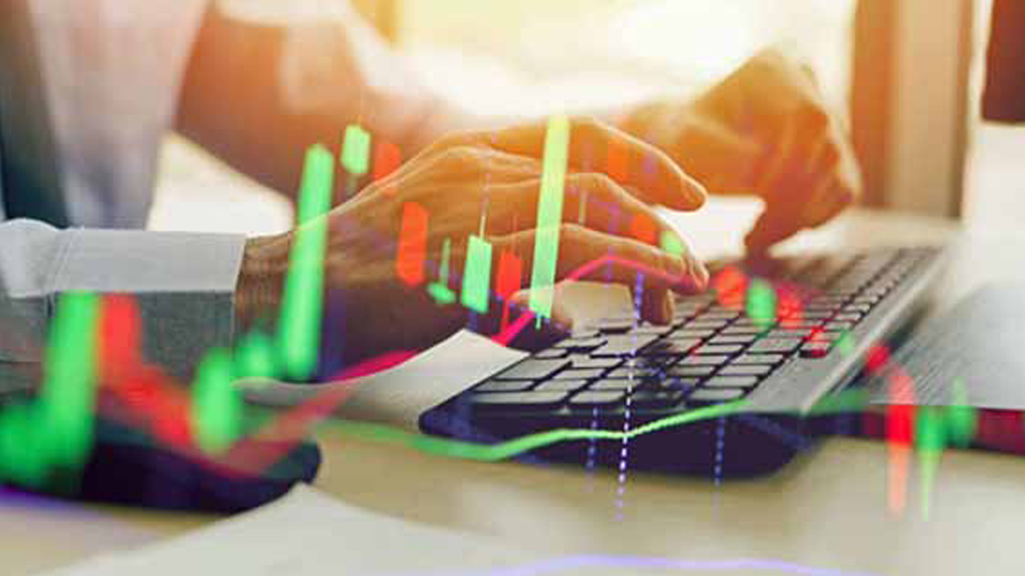 Man typing with overlayed graphs
