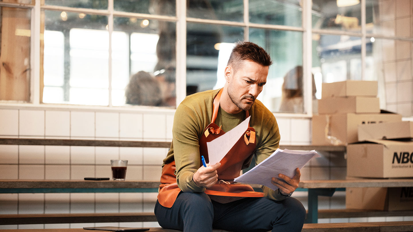 Male worker with paperwork