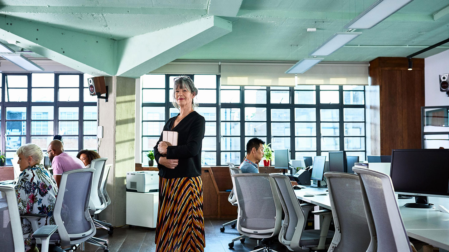 Business woman standing in office Business woman standing in office