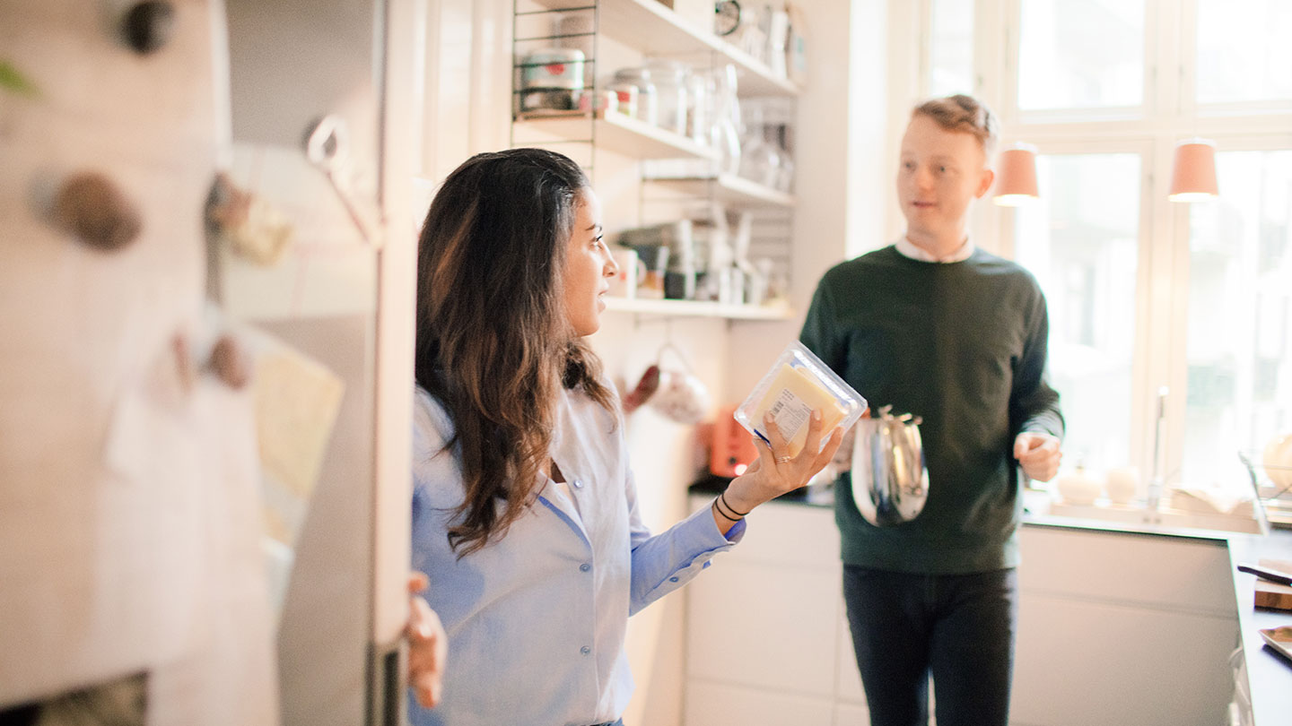 Woman in kitchen with child