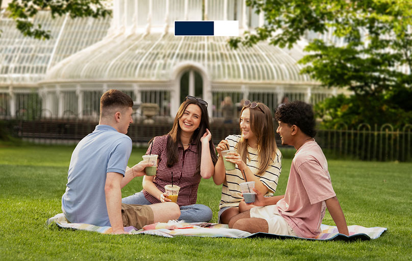 Friends relaxing with smooties at Botanic Gardens Belfast