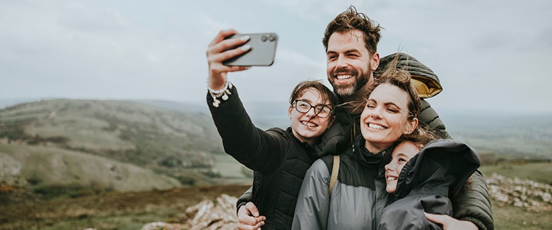 Family taking selfie in the mountains