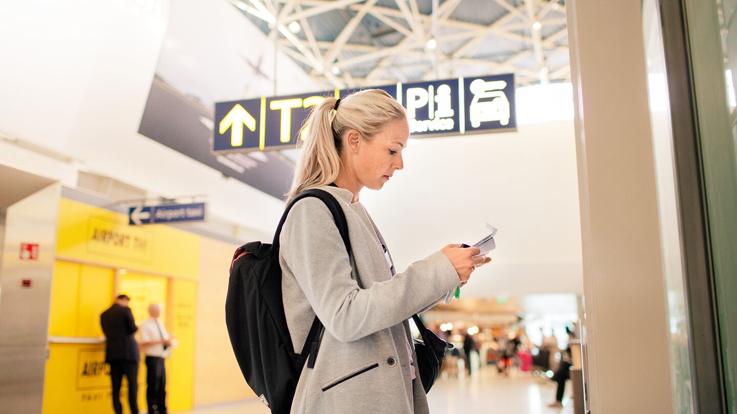Woman in airport reading