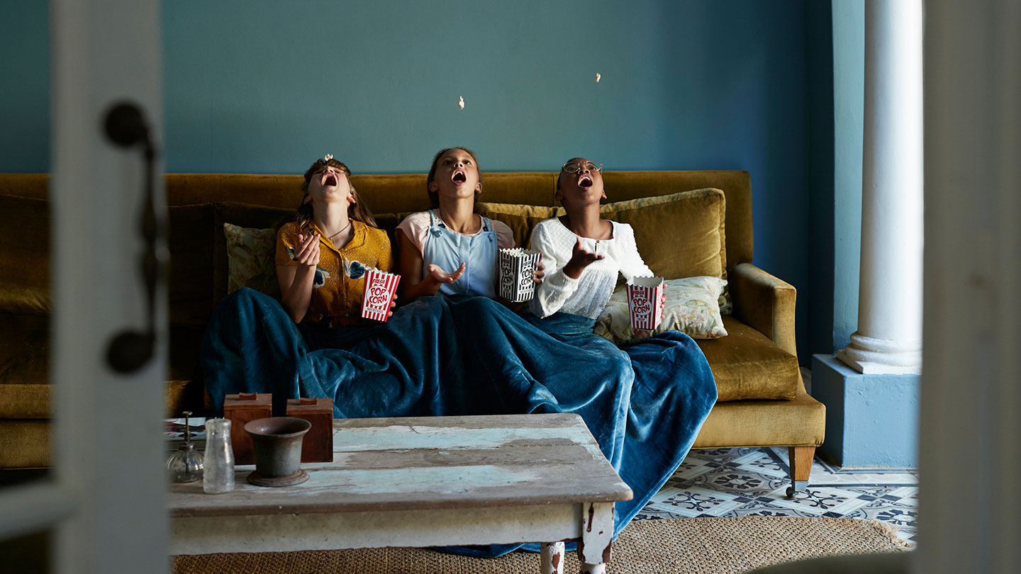 Young girls eating popcorn Young girls eating popcorn