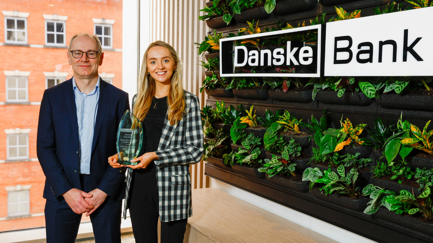 Ciara Morren receives her award in the Boardroom from Danske Bank’s Deputy CEO and Chief Financial Officer, Stephen Matchett. 