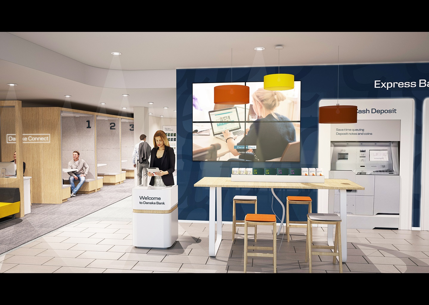 Image shows a mocked up version of the welcome hall of the new Bloomfield Danske Bank branch. To the left are Danske Connect pods, a light yellow. To the righ is a navy wall with a big TV, a high table and stools and some express deposit machines for lodging money.