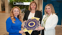 Danske’s commitment to diversity and inclusion recognized with Gold Award Three women stand together holding a large gold Diversity Mark symbol.