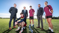 NISFA Schools' Cup launch 2023/24 Six people stand outside on a football pitch. Three players from Dungannon Inegrated Colleage and three adults from Danske Bank and NISFA.