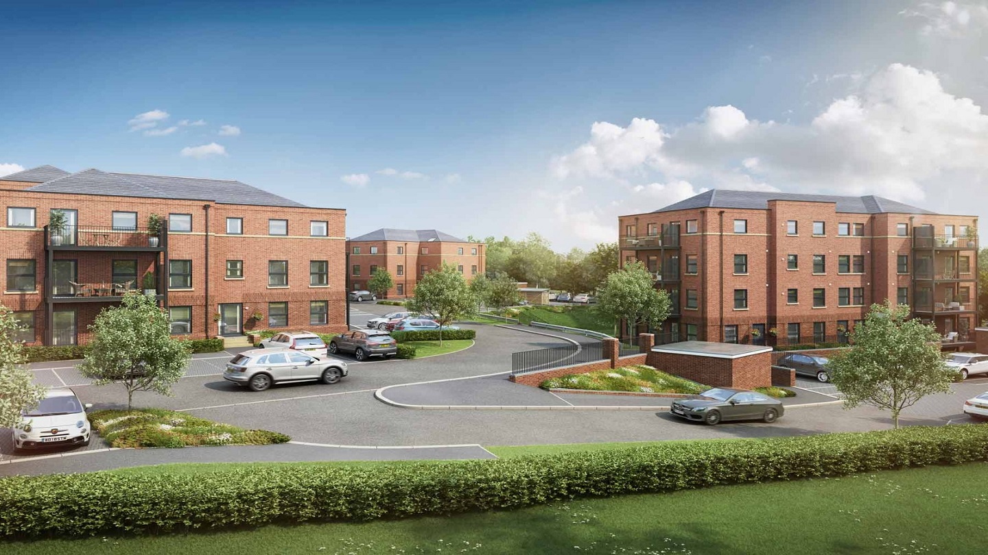 Image outdoors showing some red bricked buildings with cars parked in the grounds in front.