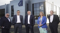 Danske Bank and UK Export Finance package key to export success for The Deluxe Group Five people standing outside a The Deluxe Group building.