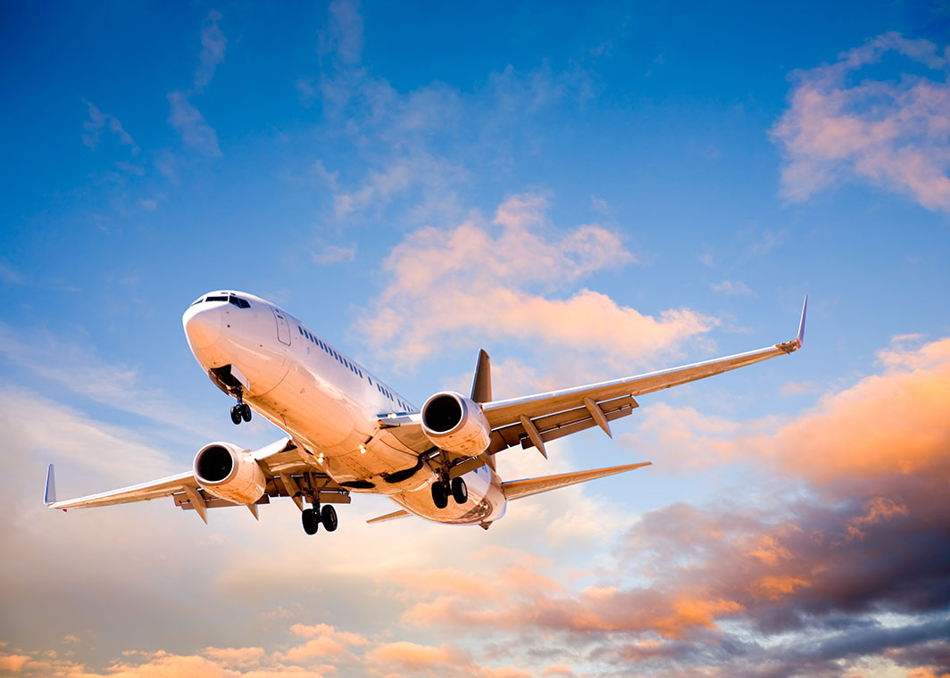 Aeroplane in sky with landing gear deployed