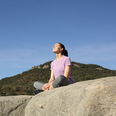 woman sitting enjoying sun