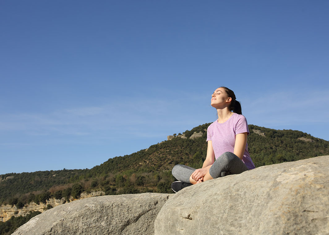 woman sitting enjoying sun