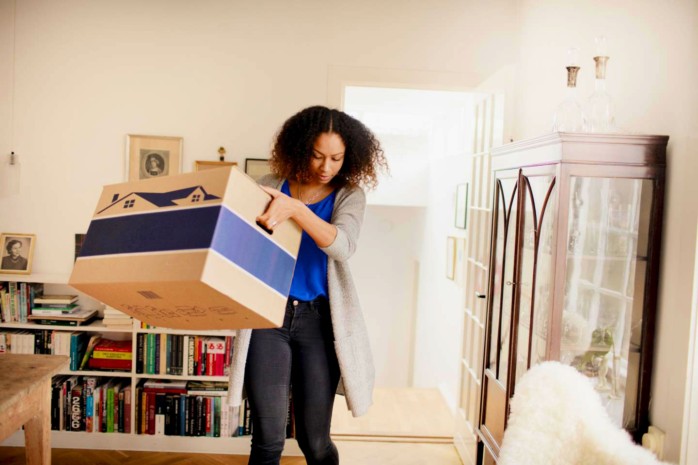 Young woman packing to leave